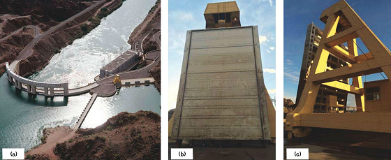 Parker Dam (a) has four penstock gates on the west side of the main river (shown on the right). A hoist crane is used to access the upstream (b) and downstream (c) sides of the penstock gates.