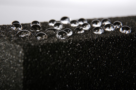 Water is seen beading on a piece of FOAMGLAS® cellular glass insulation. FOAMGLAS® insulation consists of millions of hermetically sealed glass cells and is impervious to water in liquid and vapor forms.