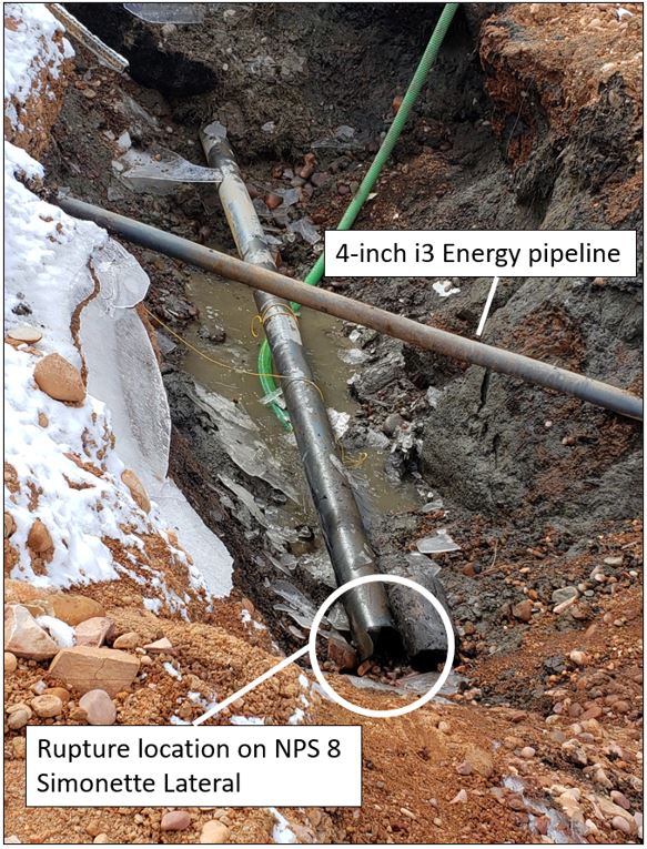 The crater and exposed pipelines. Photo courtesy of TSB.