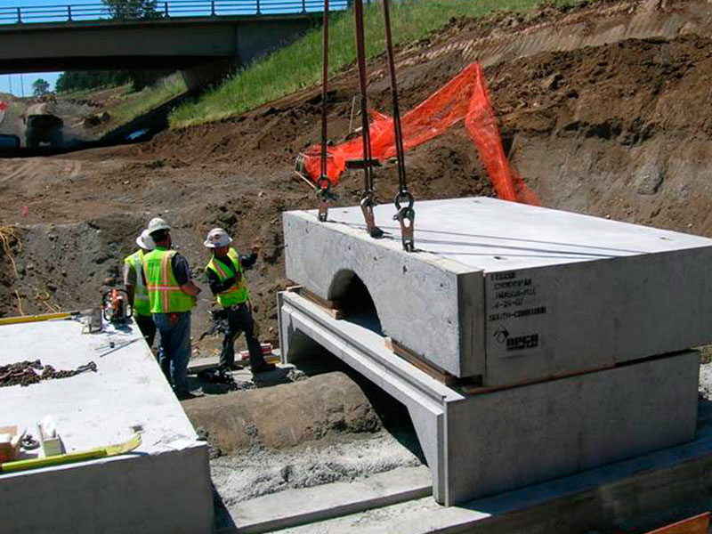 A continuous foundation footing and floor slab were installed around the pipes, followed by the precast box culvert and end walls. Image courtesy of Stuart Greenberger.