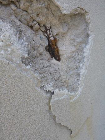 Spalling concrete on a hotel wall shows corroded reinforcing rods. Photo courtesy of ACA.