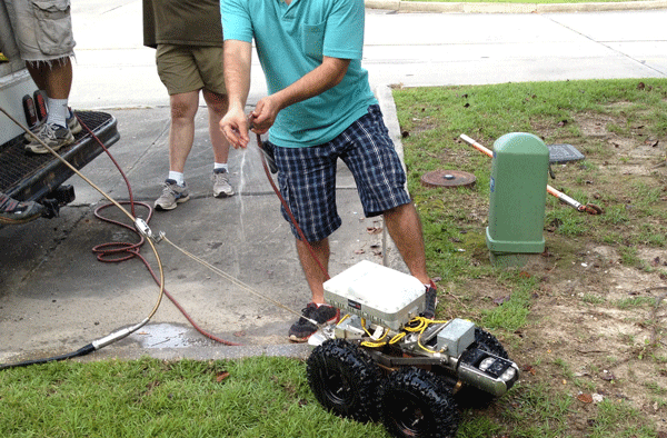 FIGURE 1: The radar device is strapped to the top of a pipe-inspection robot and integrated into existing assessment software. Photo courtesy of Louisiana Tech University.