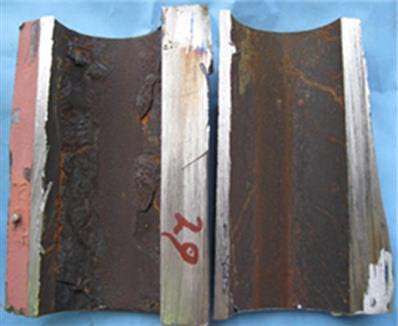 Internal UDC was found under thick, adherent deposits on the hot side (left). The cool side (right) had a small of amount of deposits and little internal corrosion.