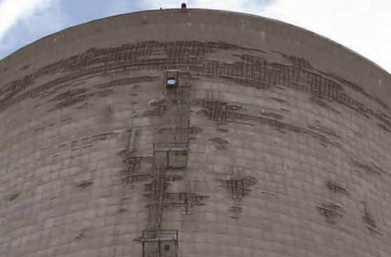 Concrete deterioration at upper section of the cooling tower for Unit #3 in 2010, including removed concrete from “de-spalling” efforts.