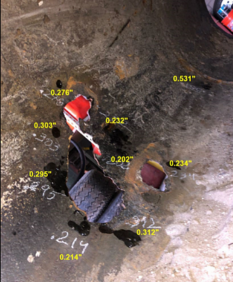 Ultrasonic thickness testing in the area of the breach. Photo courtesy of BRG.