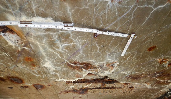 The deck underside showed chloride-contaminated concrete with associated spalling, efflorescence, and exposed rebar with section loss. Photo obtained via PennDOT.