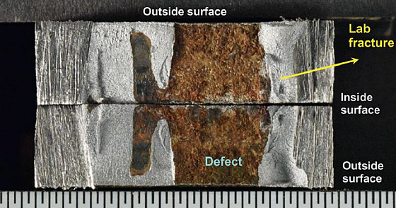 FIGURE 3 Photograph of matching surfaces following lab fracture. Scale divisions are 1/32 in.