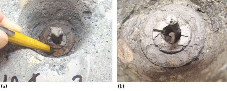 FIGURE 4 Photograph of the Tendon 3 in-place anchorage (a) upon initial exposure and (b) at a later time.