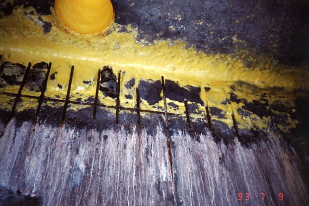 FIGURE 1: Exposed and corroded reinforcing steel was found in the upper portion of the wall.