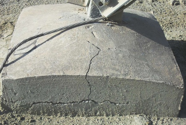 FIGURE 2: A severely cracked electric distribution tower foundation.